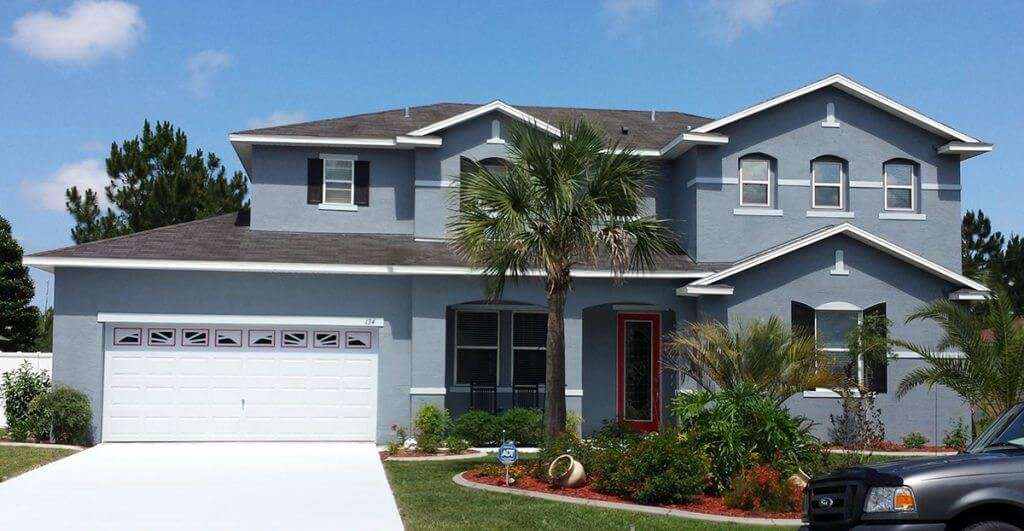 Two-story Palm Coast home painted by Dr. Paint